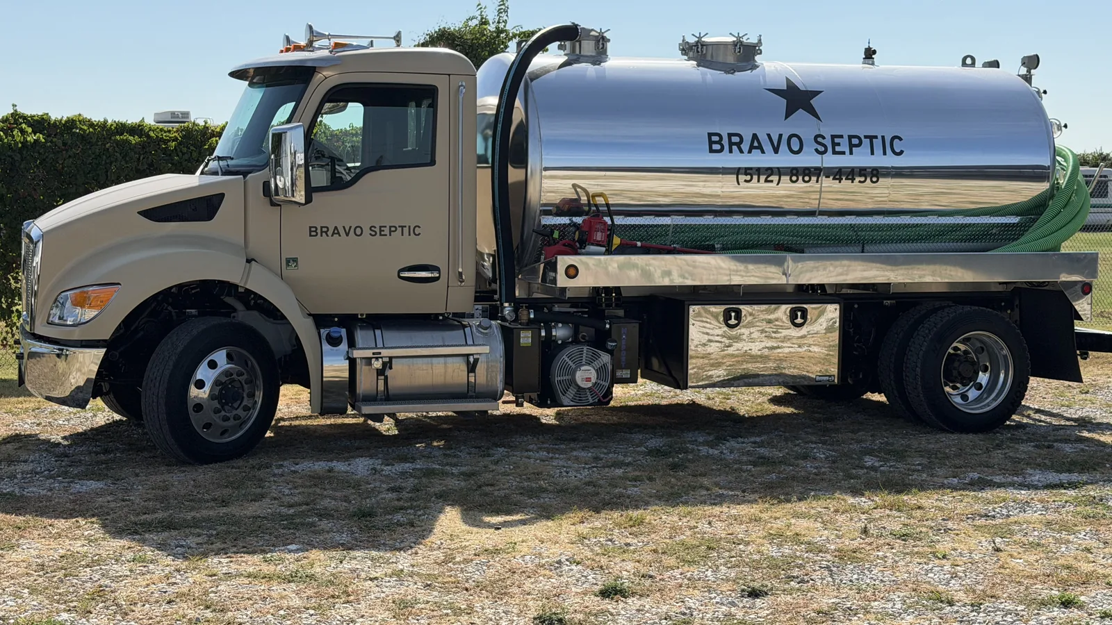 The Bravo Septic pump truck parked on a rural lot in Central Texas