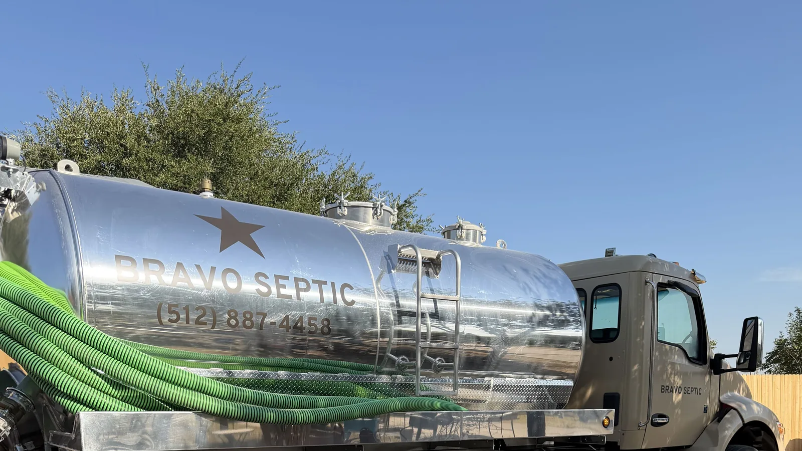 The lettered stainless tank on the Bravo Septic pump truck