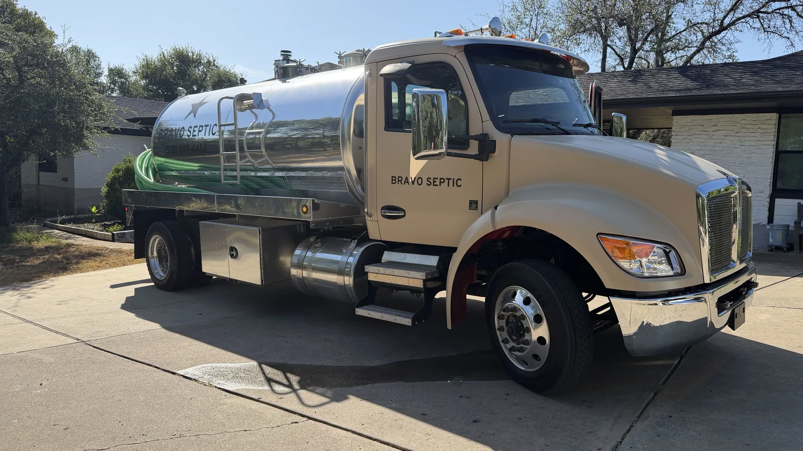 The Bravo Septic pump truck parked in front of a home on a service call