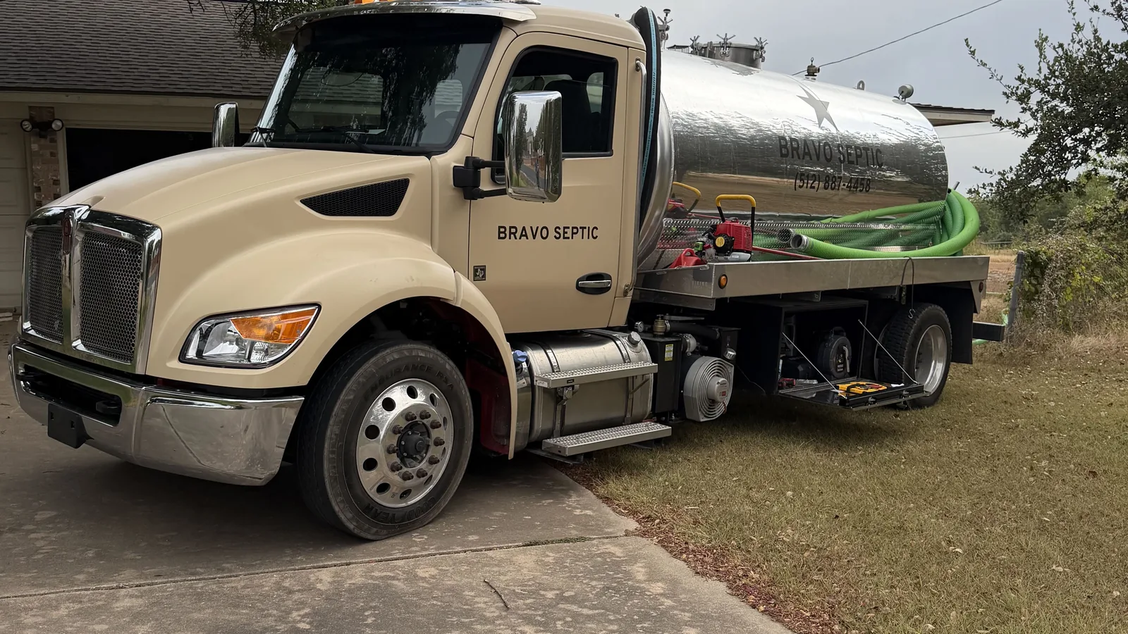 The Bravo Septic pump truck parked on a residential driveway